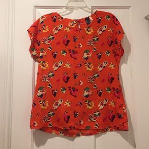 Orange blouse with flowers
