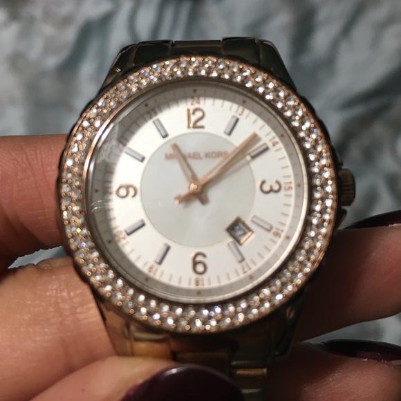 Michael Kors rose gold watch.