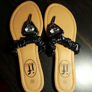 Black flats sandal, being worn