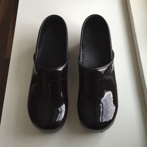 Black patent leather Sanita clogs