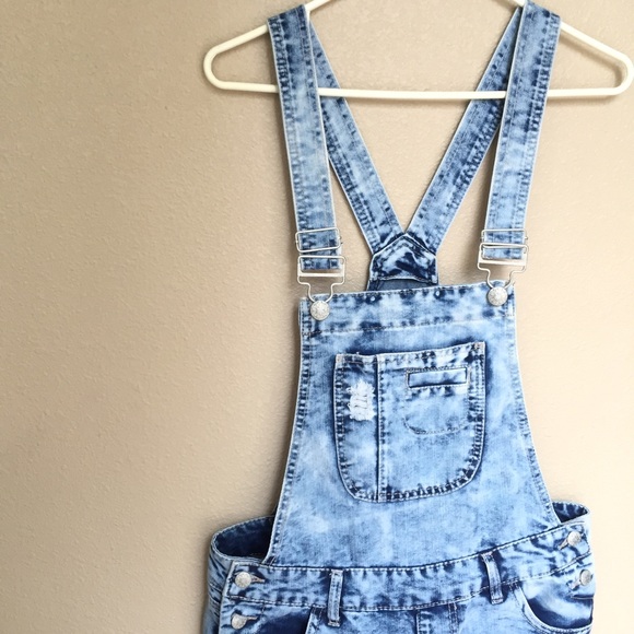 Distressed denim overalls