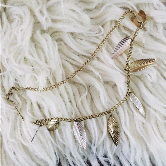 Gold and silver leaf ear cuff.
