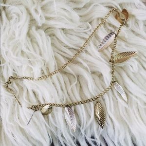 Gold and silver leaf ear cuff.