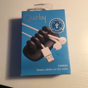 QUIRKY, keeps the cables on the table
