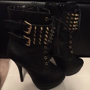 High heeled spike boots