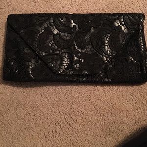 Black lace and leather clutch.