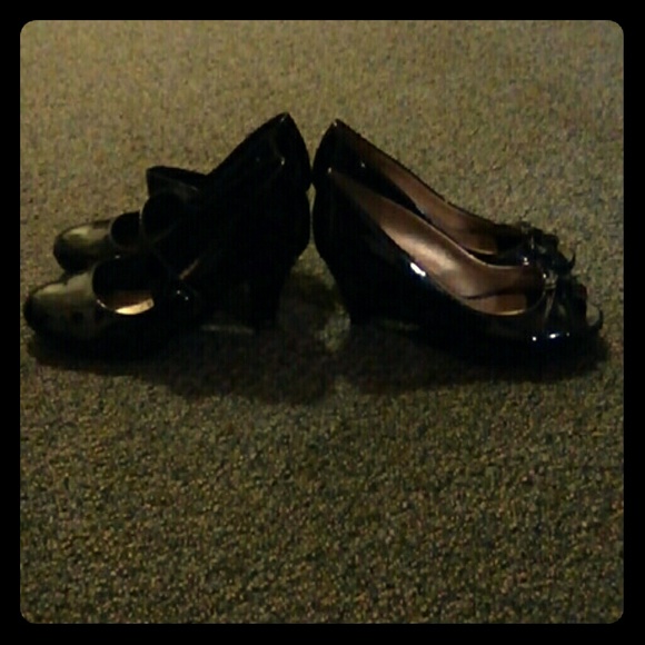 Black pumps and black peep toe wedges