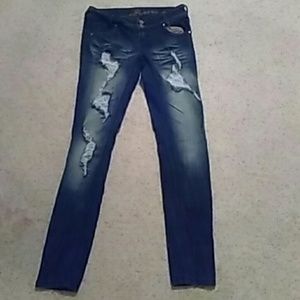 Dark blue almost black almost famous skinny jeans.