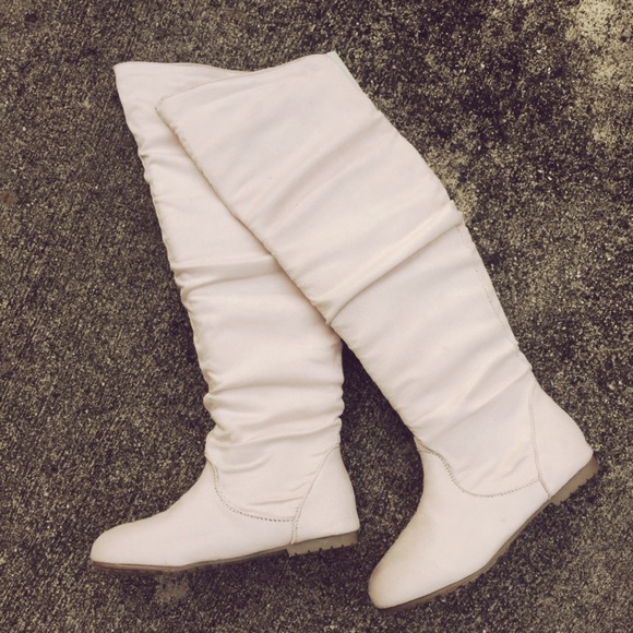 cream colored knee high boots