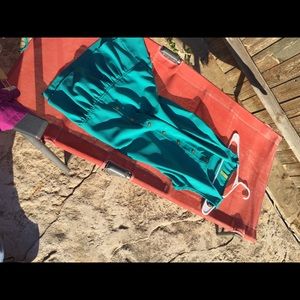 Blue dress with cute buttons on the front of it