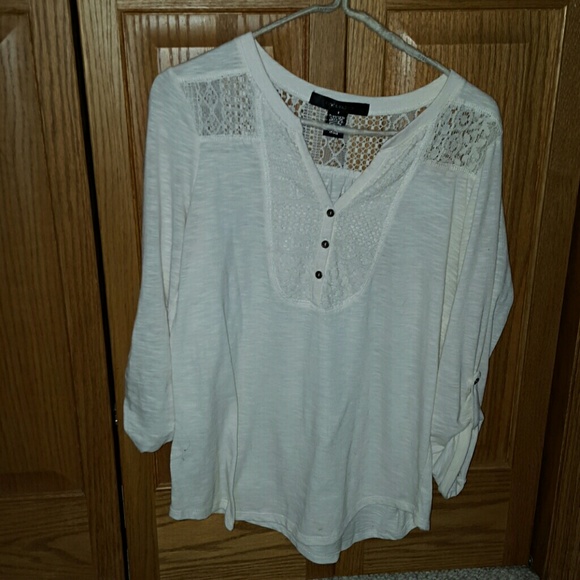 Three quarter length cream colored top