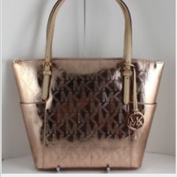 Michael Kors rose color logo handbag.