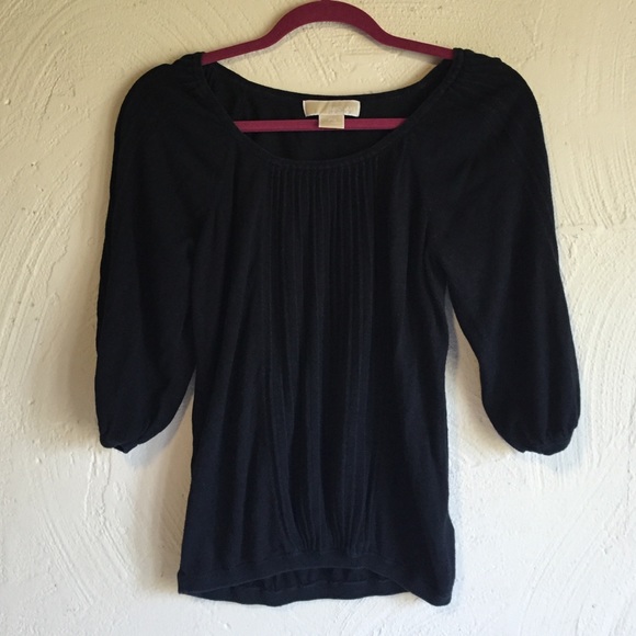 Black Michael Kors top.