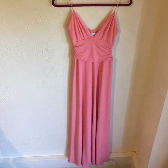 Coral colored formal dress.