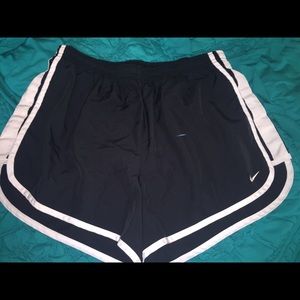 Black Nike running shorts