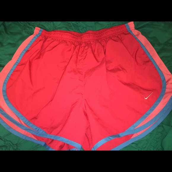 Bright pink Nike running shorts