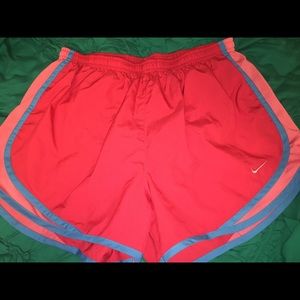 Bright pink Nike running shorts