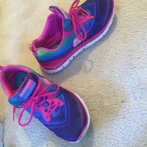 Used rainbow sneakers. They have foam on the sole