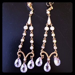 Gold chandelier earrings.