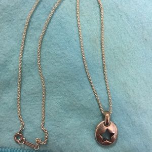 Tiffany and Co stencil star necklace.