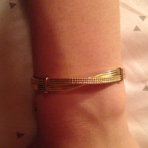 Gold bangle with diamond insets