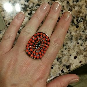 Coral colored stretch-band statement ring