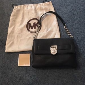 Authentic Michael Kors black leather shoulder bag.