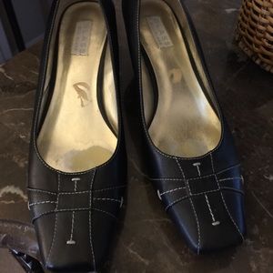 Black shoes with white stitching detail