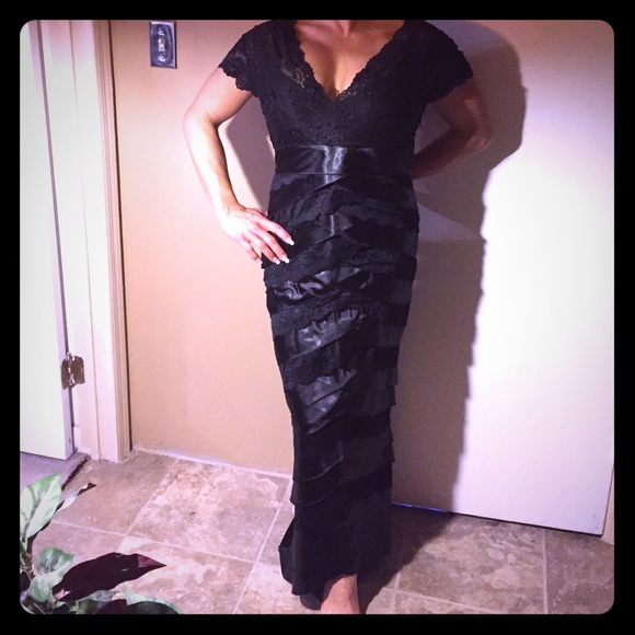 Evening lace dress with train in the back