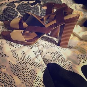 Brown, nude and black Merona wedges.