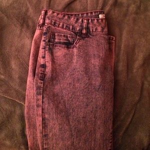 Lightly colored pink/blue stressed jeans