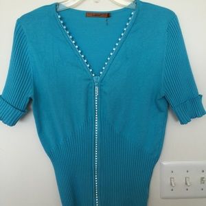 A beautiful and soft beaded blouse/sweater.