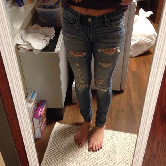 AE medium wash jeans with trendy holes