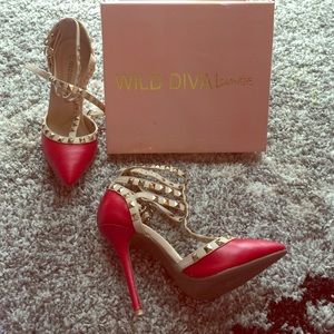 Red studded pointy toe pumps