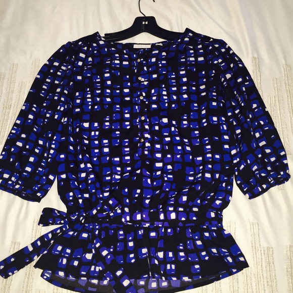 Multi color blouse with matching belt.