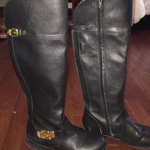 Tall black riding boots
