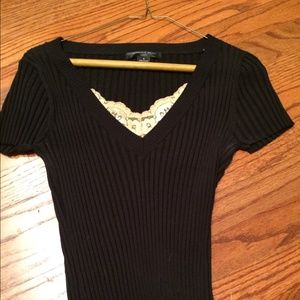 Black top with gold lace trim.