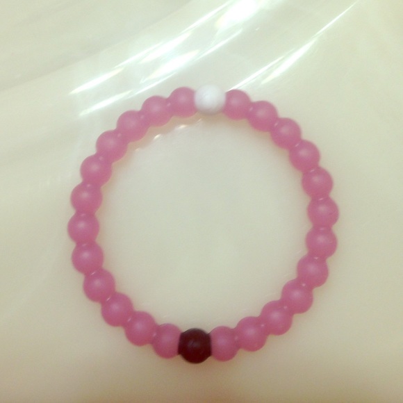 Pink Lokai bracelet.