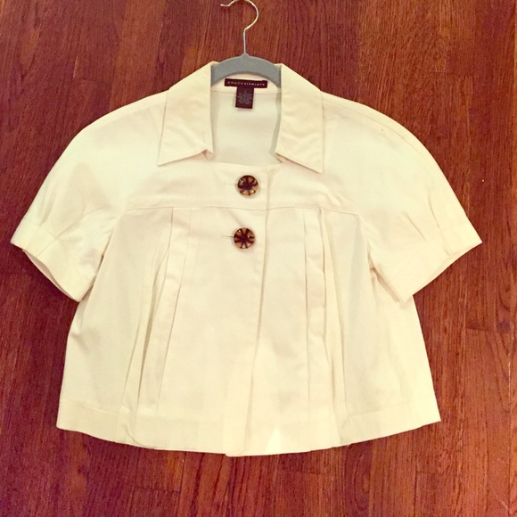White cropped jacket with tortoise shell buttons