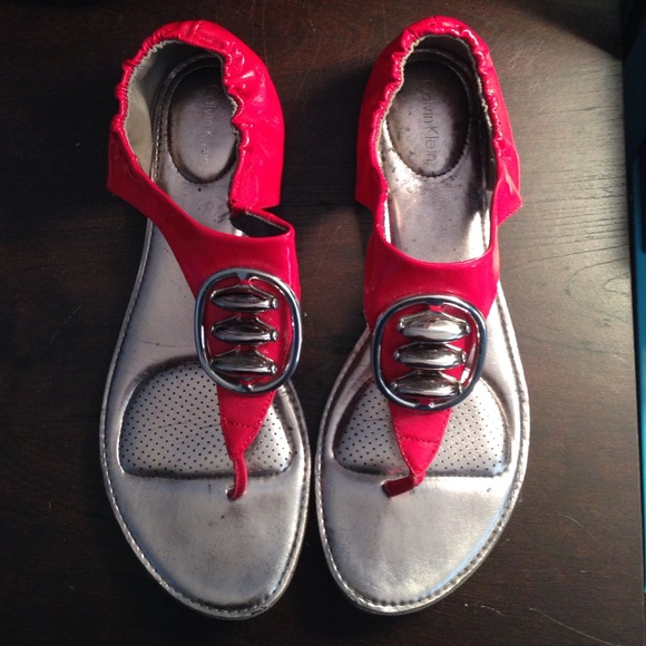 Red Calvin Klein sandals with metal garnish