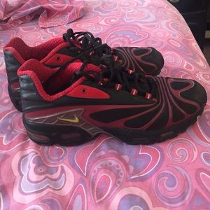 Red and Black Nike AirMax tailwinds.
