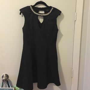 Dress with jeweled neck and cut out in middle