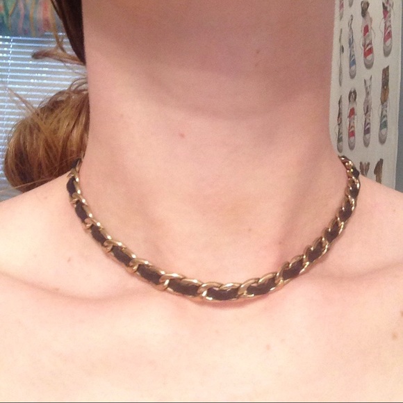 Gold necklace with black strands and gold clasps