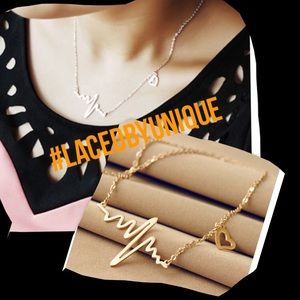 Woman's gold necklace with heart