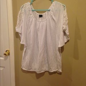 A white crocheted short sleeve shirt