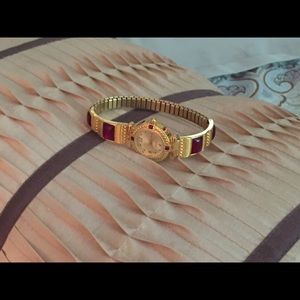 Gold and burgundy watch