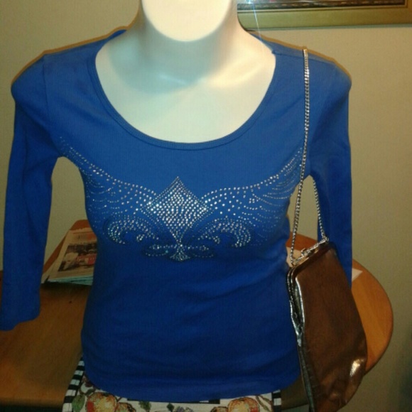 Long sleeve top/Never been worn without tag.