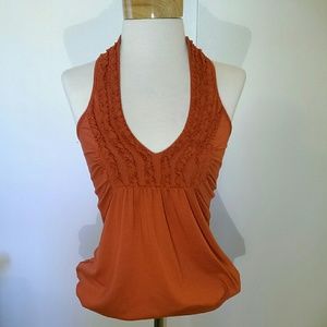 Burnt orange, halter top.
