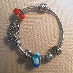 Pandora 7 inch Bracelet with 6 charms.