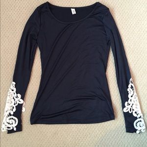 long sleeved shirt with lace at the end of sleeves